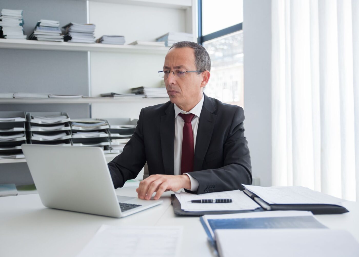 Professional checking his 401(k) contribution rate and employer match online