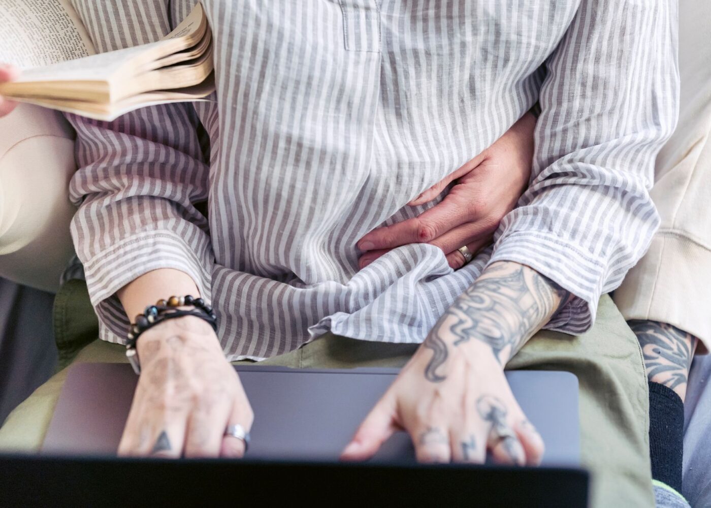 Couple booking a summer trip on a laptop and choosing how to pay at checkout