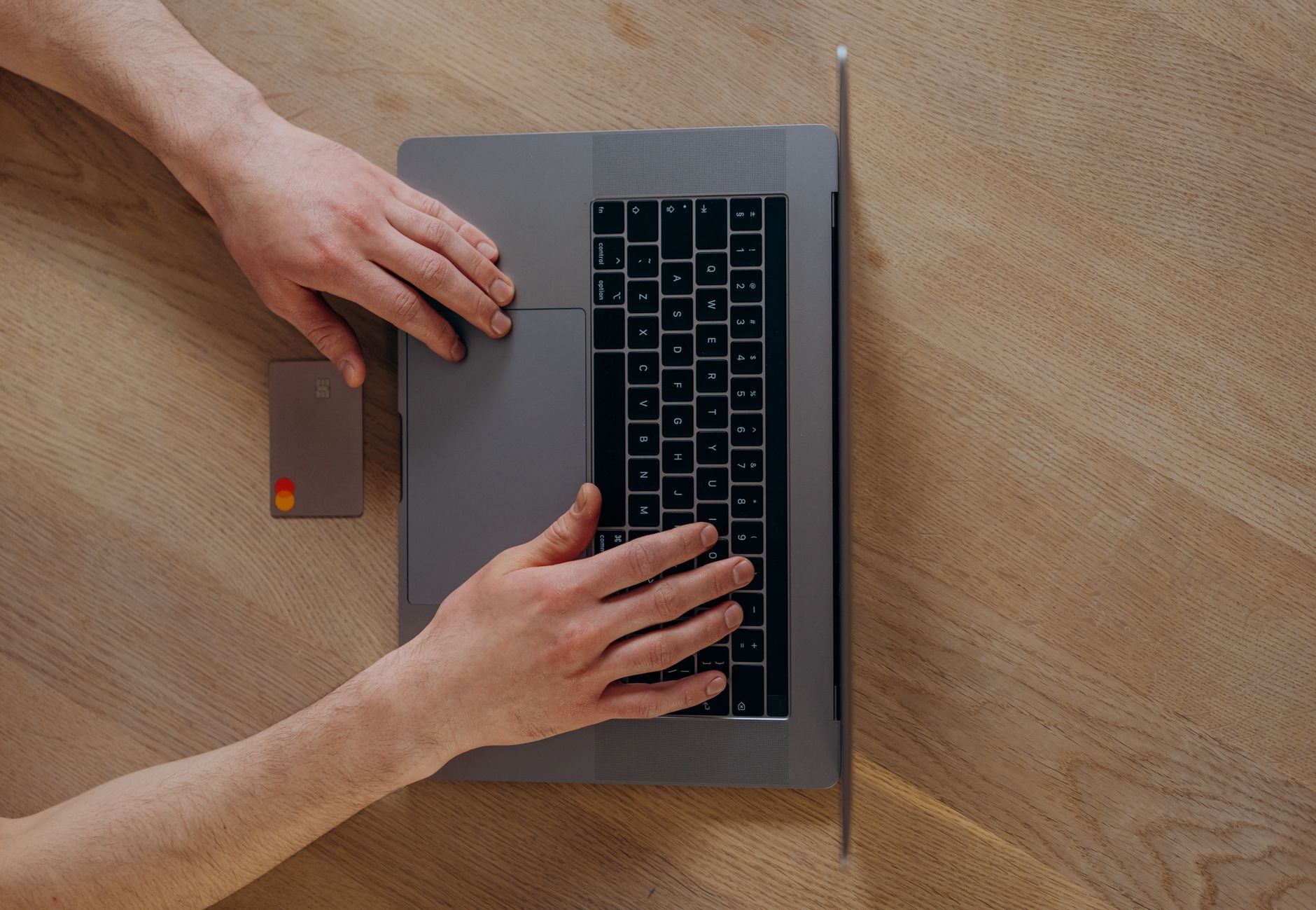 Person entering credit card details online to pay a tax bill