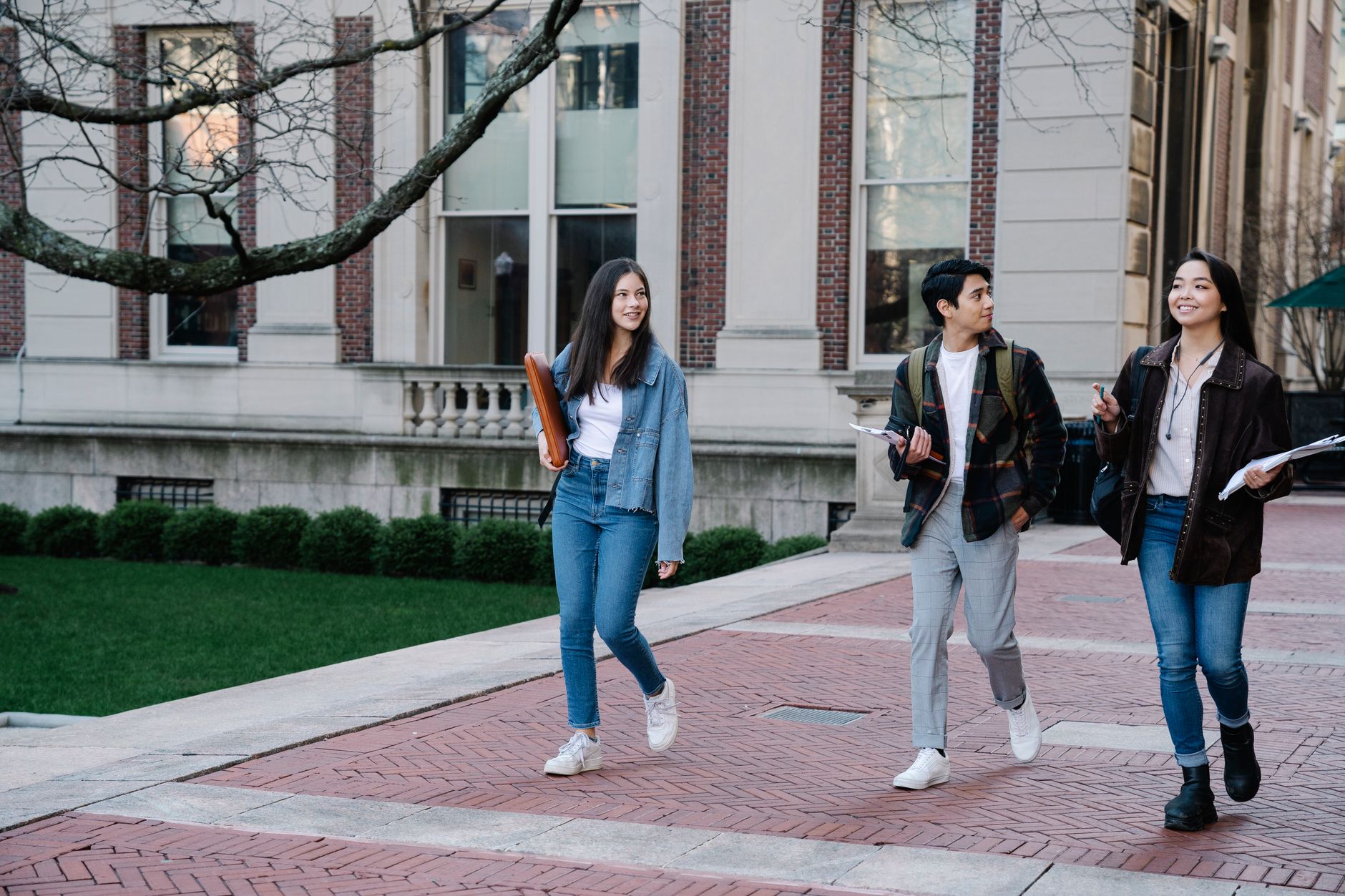 College student walking across campus at the start of the fall semester
