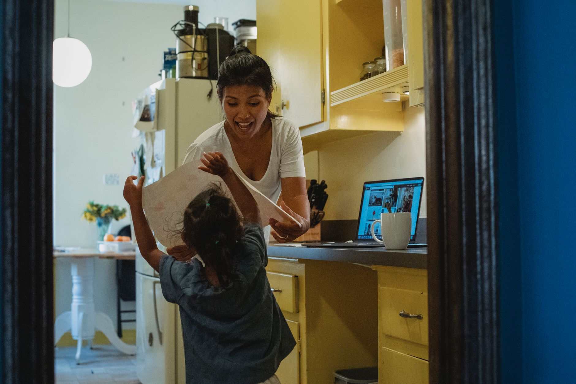 Parent and college-age daughter setting up an authorized user card online together