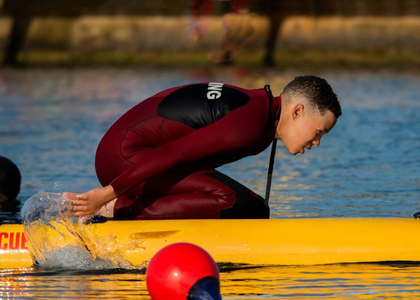 Teen lifeguard at a summer job, earning income that can fund a custodial Roth IRA