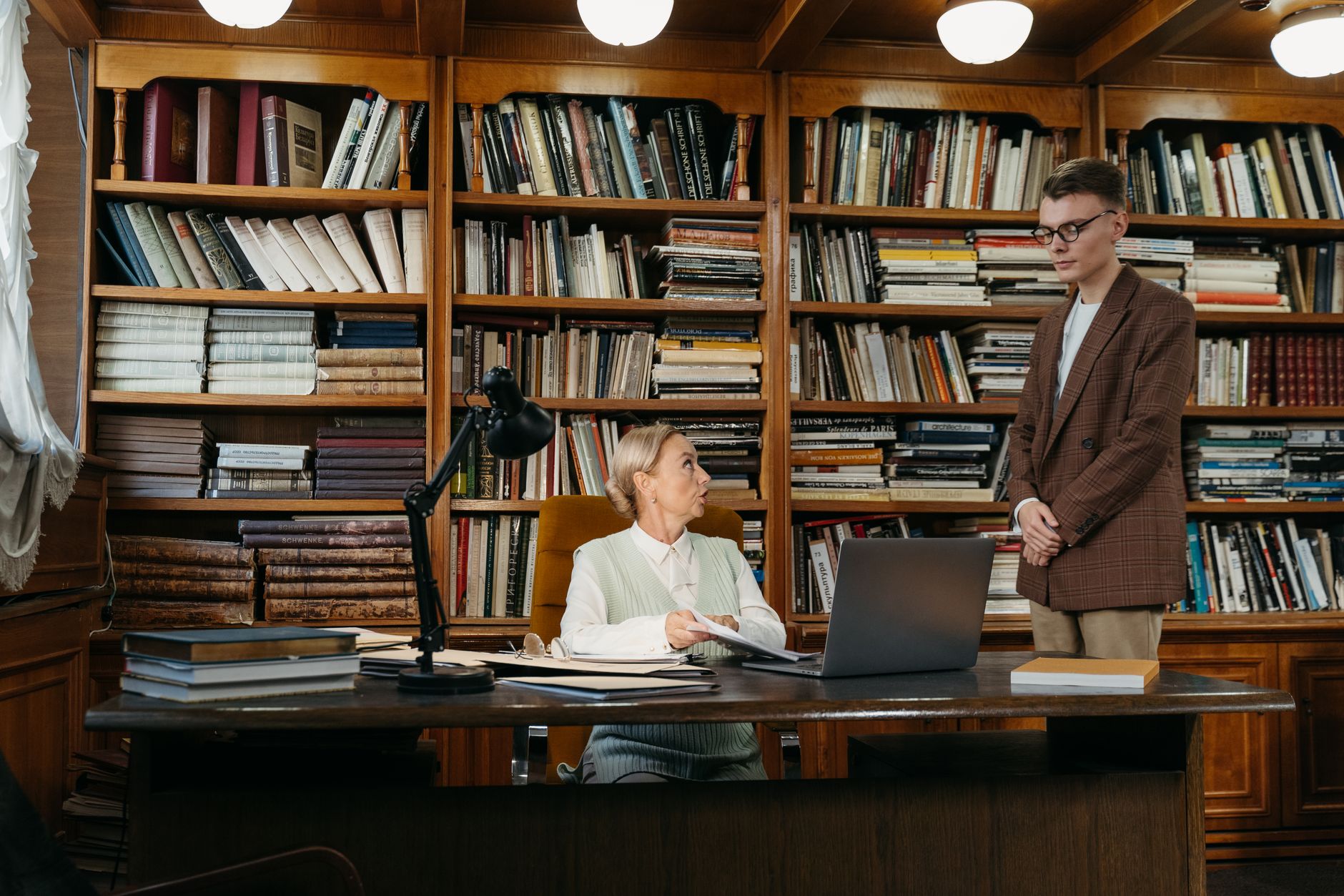Student speaking with a staff member at a university financial aid office