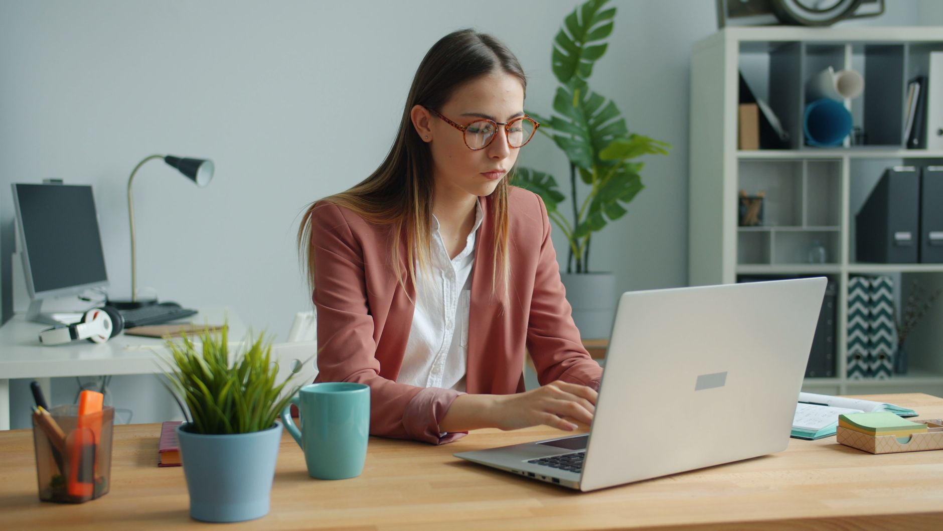 Recent graduate comparing employer benefit options before the new-hire enrollment deadline
