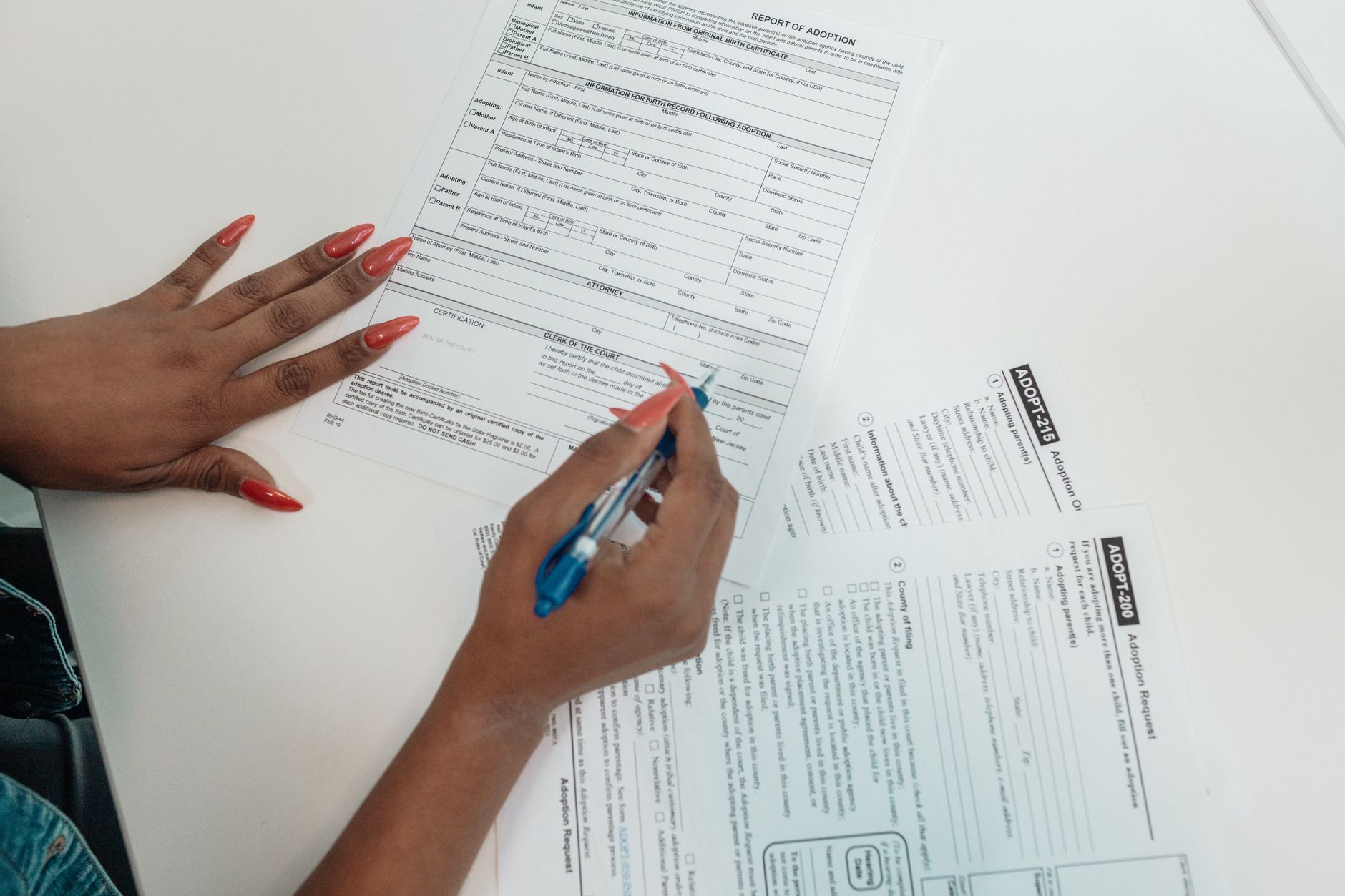 Employee filling out a new W-4 form to raise paycheck withholding