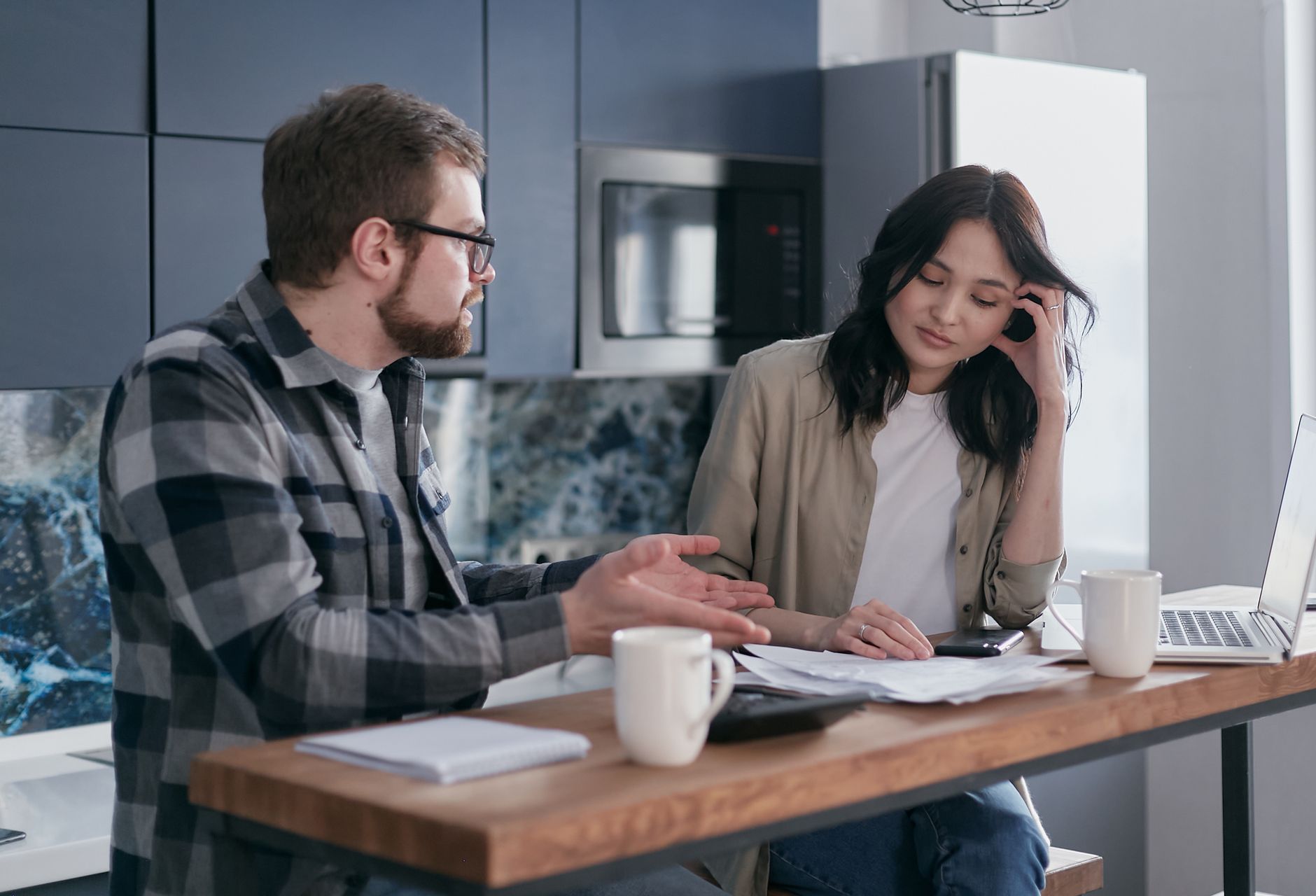 A tax preparer walks a client through refund transfer paperwork before e-filing