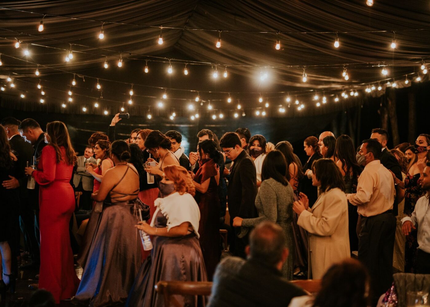 Guests celebrating at a summer wedding reception